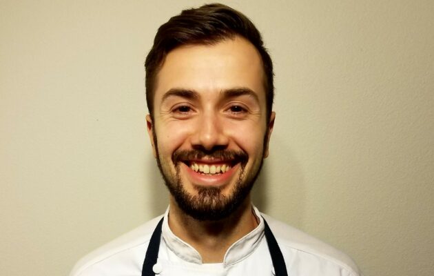 Portrait photo of Dante in a chef's uniform