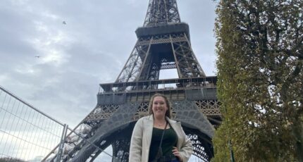 Lexie in front of the Eiffel Tower