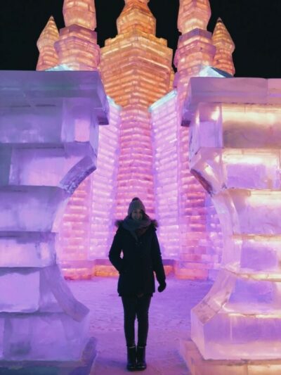 Courtney in front of ice sculptures